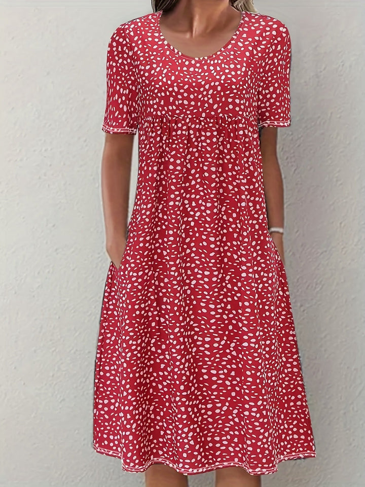 Elegancka damska sukienka do kolan z krótkim rękawem, luźnym krojem i zaokrąglonym dekoltem - wygodny, lekki styl casualowy
