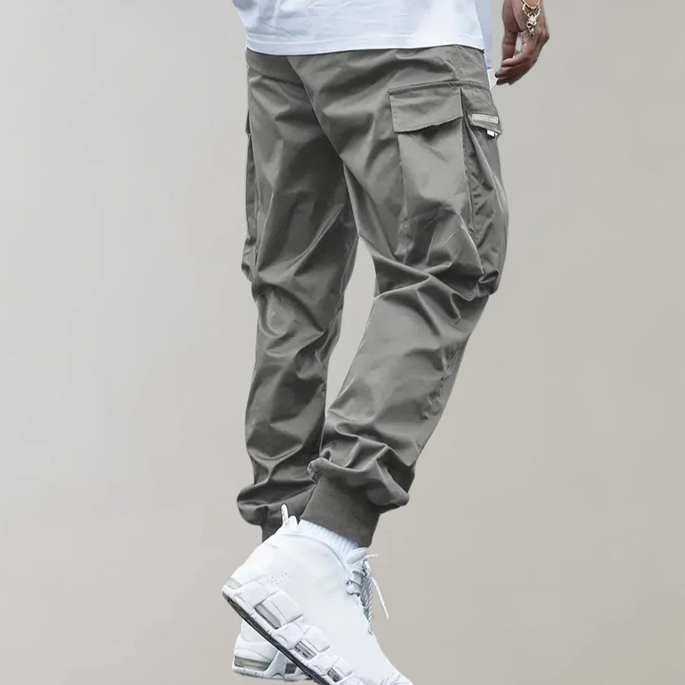 Finn - Męskie spodnie Slim Cross Pants zapewniające nowoczesny i wygodny wygląd