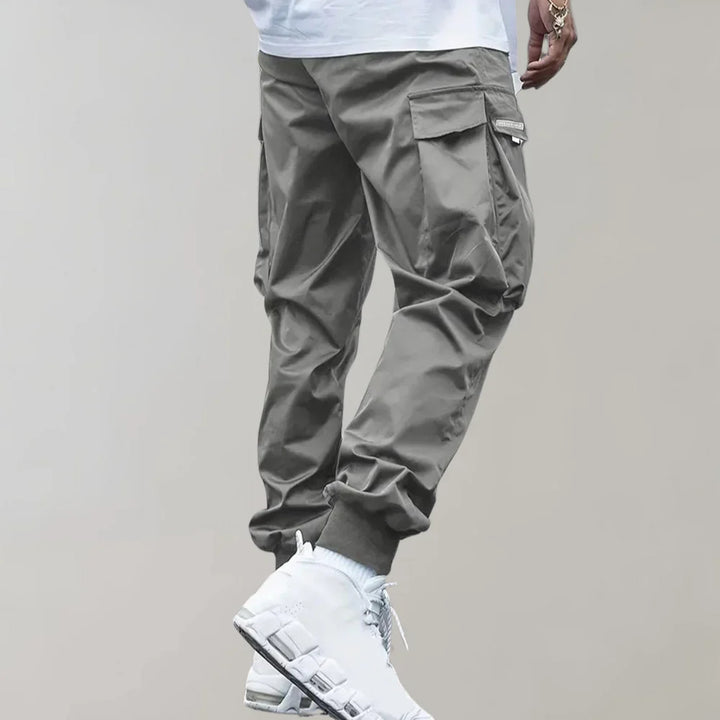 Finn - Męskie spodnie Slim Cross Pants zapewniające nowoczesny i wygodny wygląd