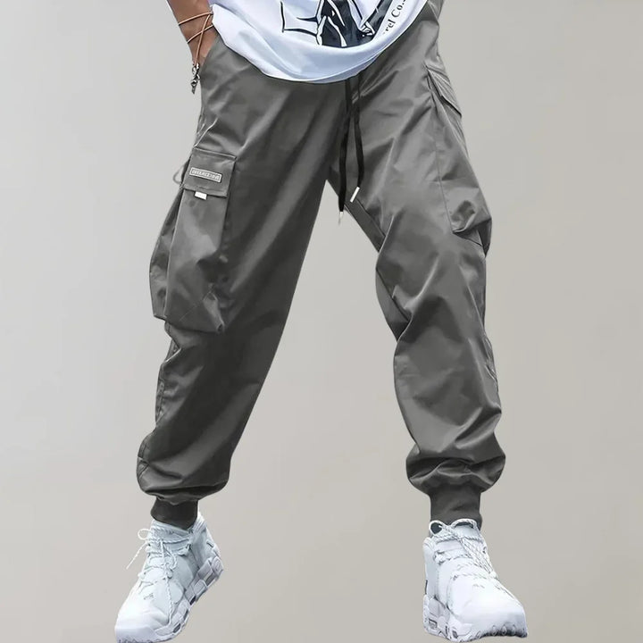 Finn - Męskie spodnie Slim Cross Pants zapewniające nowoczesny i wygodny wygląd