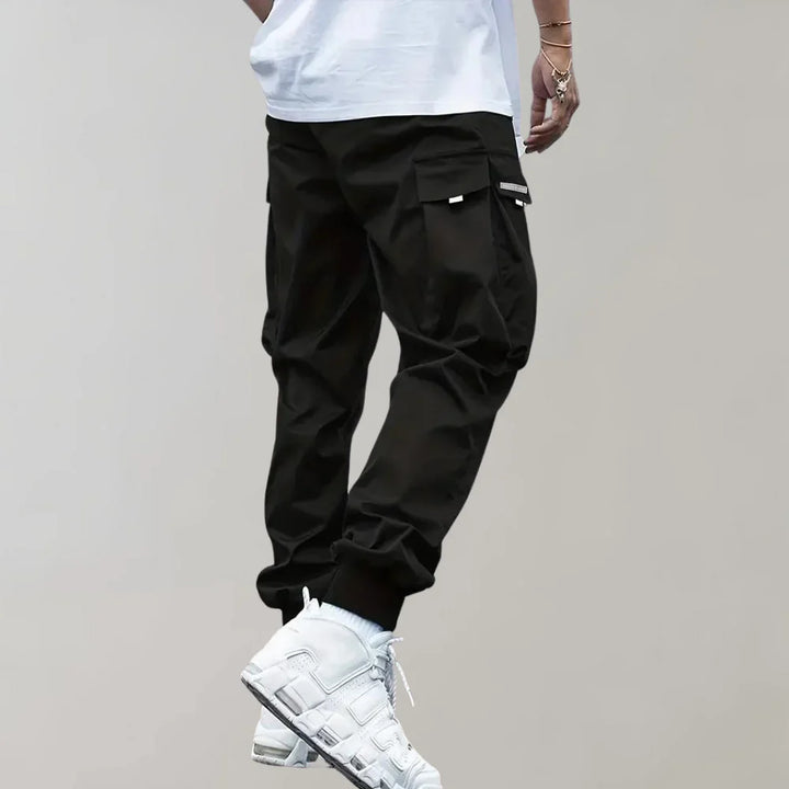 Finn - Męskie spodnie Slim Cross Pants zapewniające nowoczesny i wygodny wygląd