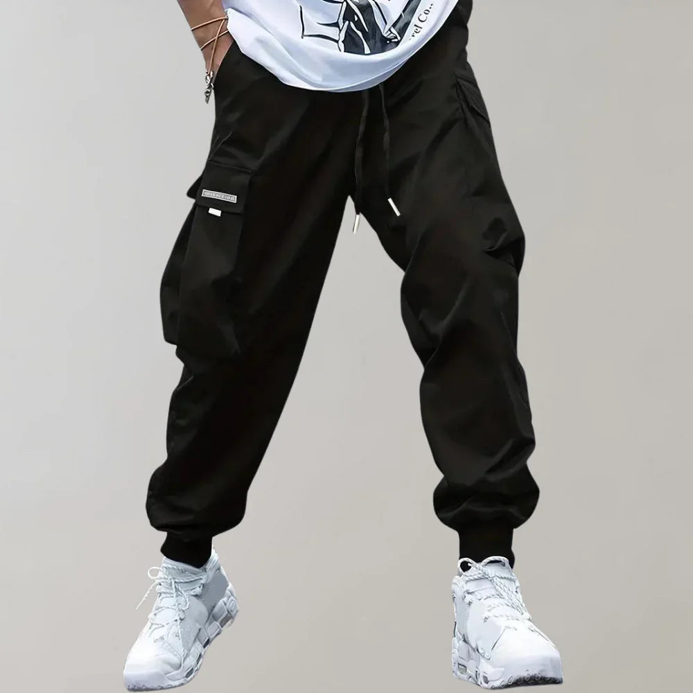 Finn - Męskie spodnie Slim Cross Pants zapewniające nowoczesny i wygodny wygląd