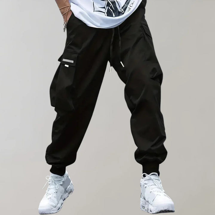 Finn - Męskie spodnie Slim Cross Pants zapewniające nowoczesny i wygodny wygląd