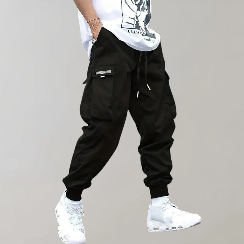 Finn - Męskie spodnie Slim Cross Pants zapewniające nowoczesny i wygodny wygląd