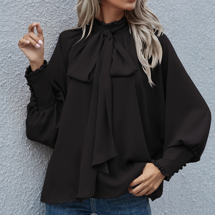 Elegancka szyfonowa bluzka Isalie z kokardą i bufiastymi rękawami zapewnia stylowy wygląd
