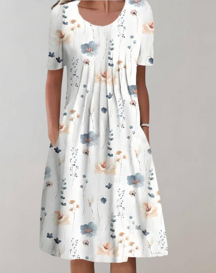 Eloise - Charmante Blumen-Smocks-Kleid mit Rundhalsausschnitt und praktischen Taschen