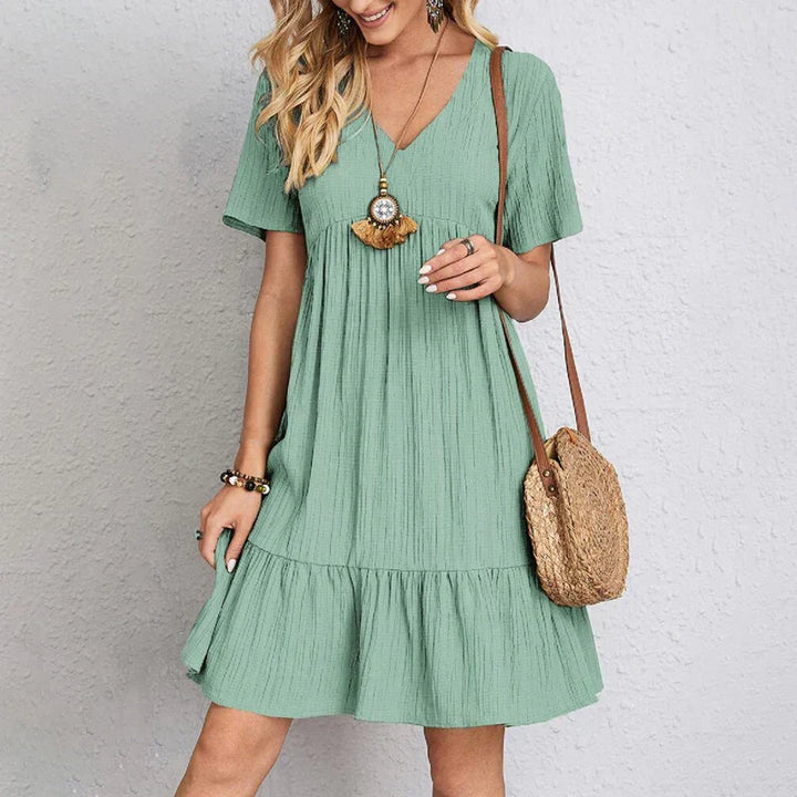 Chic Women's Casual Dress with V-Neck, Short Sleeves, Ruffled Hem, Relaxed Fit, and Knee-Length Style