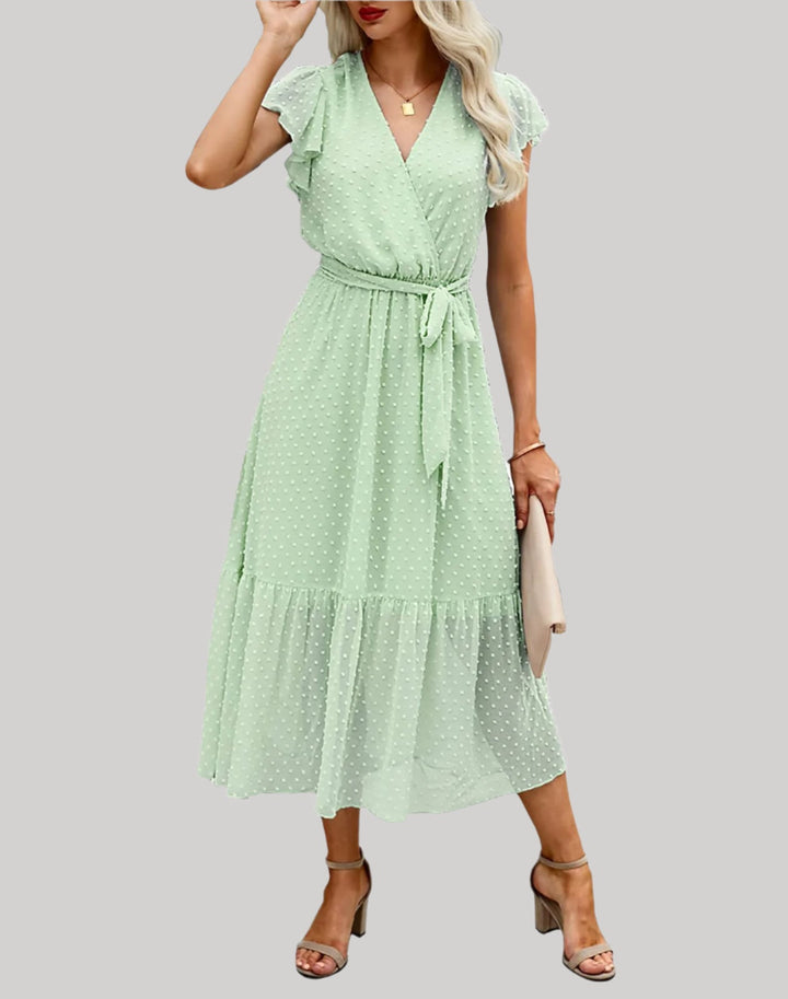 Vestido femenino glorado con escote en V, mangas cortas abullonadas y dobladillo con volantes para un estilo relajado y elegante