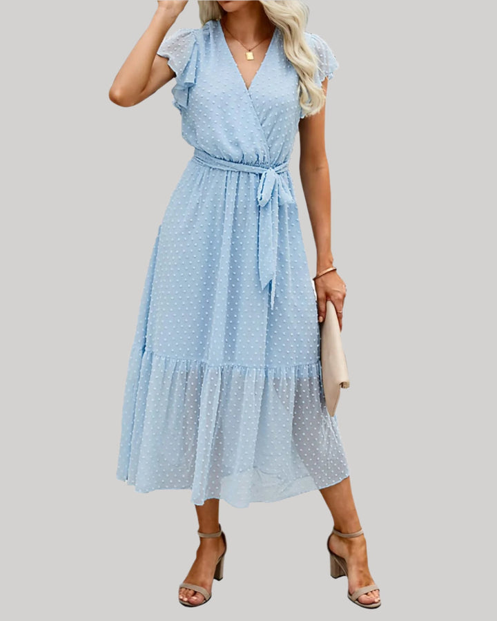 Vestido femenino glorado con escote en V, mangas cortas abullonadas y dobladillo con volantes para un estilo relajado y elegante